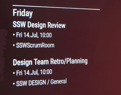 The SophieHub display showing Friday's meetings, including SSW Design Review and Design Team Retro/Planning