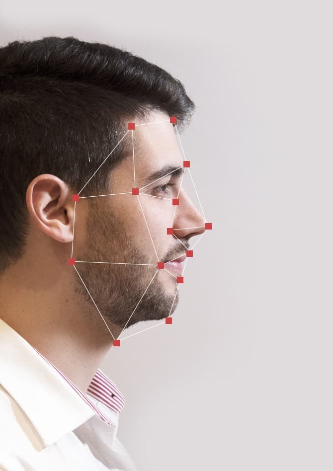 A man's face mapped with facial recognition points